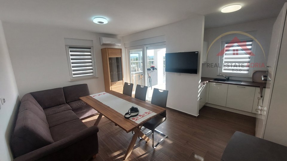 A beautiful two-room apartment with a large garden and a sea view is for sale, new building, Turanj, Zadar County, Croatia