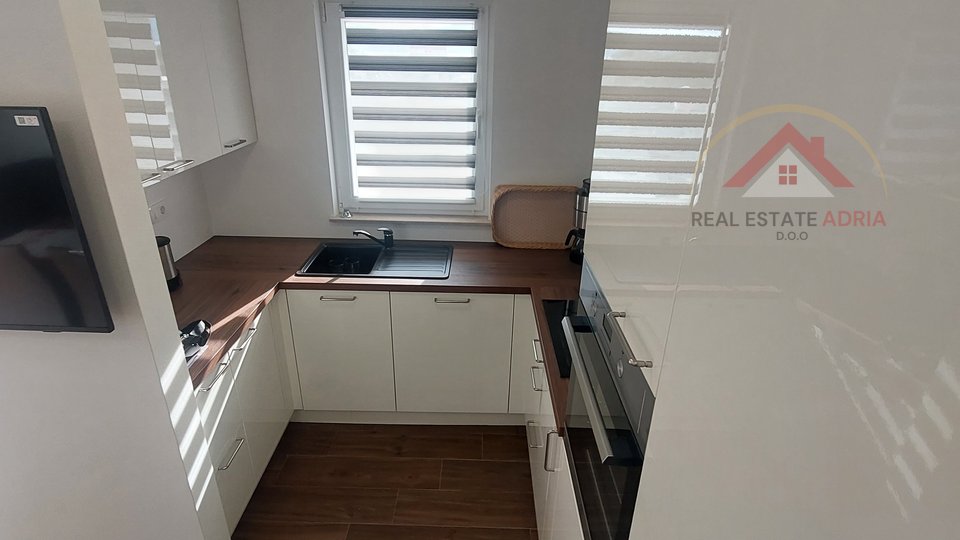 A beautiful two-room apartment with a large garden and a sea view is for sale, new building, Turanj, Zadar County, Croatia
